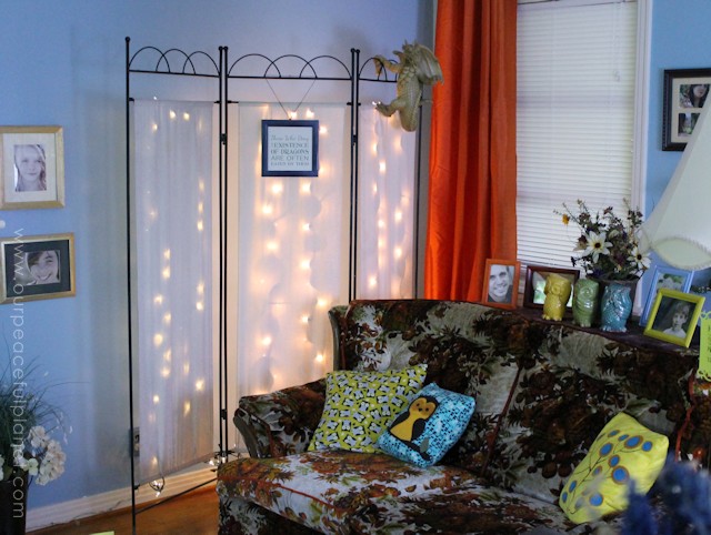You can never have too many twinkle lights! Learn how to transform a plain room divider into something magical with some twinkle lights and safety pins!