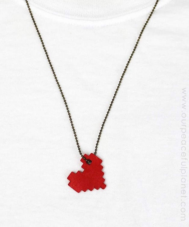 This pixel heart necklace is incredibly easy to make. All you need is some cardstock, glue and our free pattern. You'll be wearing retro jewelry in no time!