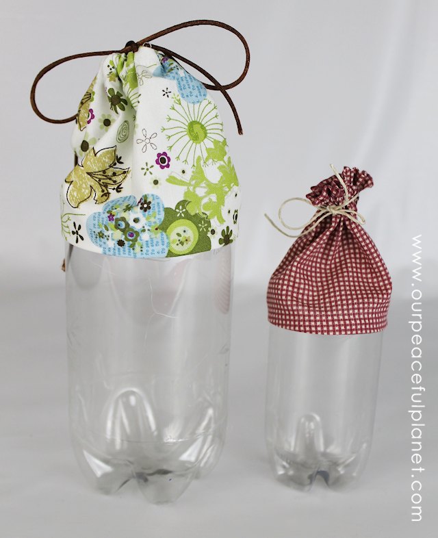 Here’s an upcycle that also helps you get more organized! Turn plastic soda bottles into carry all’s for storing all kinds of things! The scrap fabric is glued onto the bottle, though some minor sewing is done for the part the tie goes into. Ü   