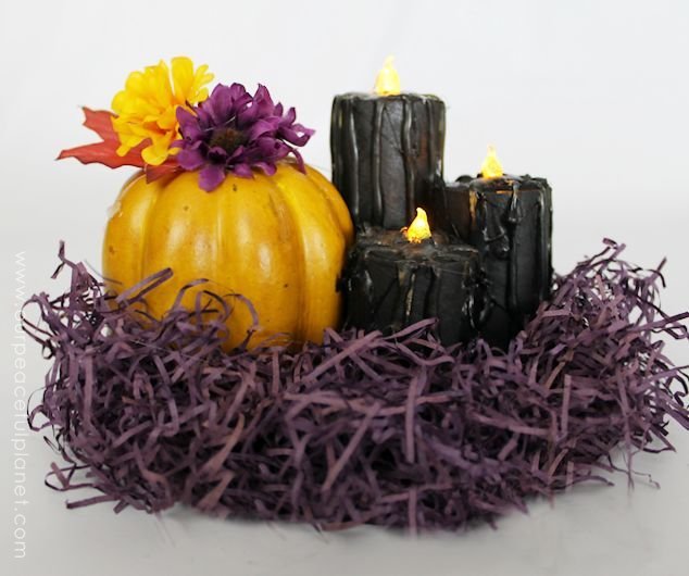 Make these eerie black Halloween decor candles made from toilet paper rolls, battery operated LED tea lights, some paint and a few extra goodies. Awesome!