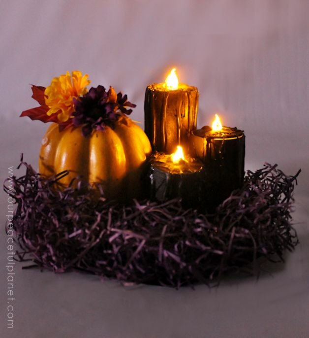 Make these eerie black Halloween decor candles made from toilet paper rolls, battery operated LED tea lights, some paint and a few extra goodies. Awesome!