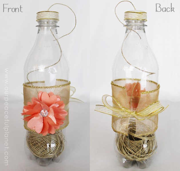 What a great way to keep string handy and easy to use! This is a plastic soda bottle with some ribbon and extras glued on. You could make several to organize various types of string or even small ribbons! Useful upcycles rock! 