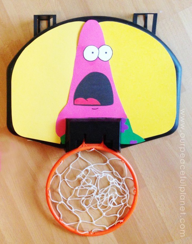 Here's how to do a quick Nerf Basketball Makeover with a little constructions paper and some scissors and glue! You can put whatever design you want on the back!