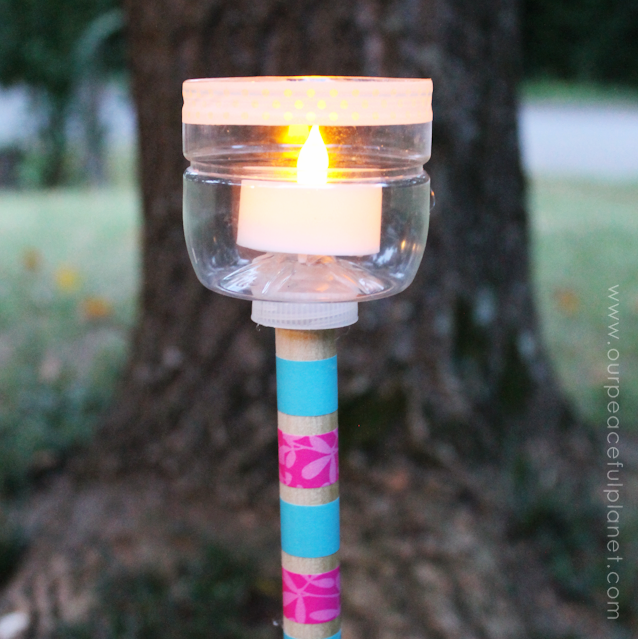 Here’s a great DIY Outdoor Lighting idea! All you need is a soda bottle, a dowel and some small battery operated LED lights that you can pick up at any Dollar Store. Not only will it brighten up your yard but it’s a wonderful Upcycle too! 