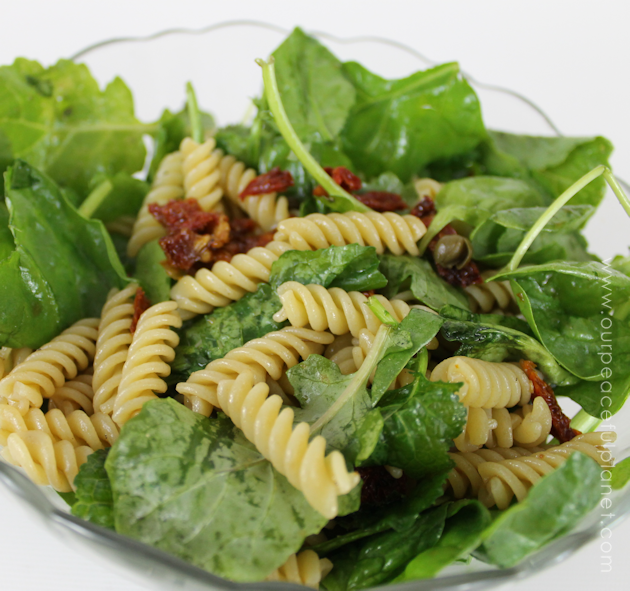 Even if your not a salad eater you will like this arugula, spinach, sun dried tomatoes and capers healthy pasta salad. It's quick to make a very filling!