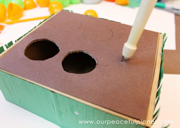 Make this cute carrot garden diy Easter basket using plastic eggs, a box and some construction paper! You can fill the box and the carrot eggs with goodies.