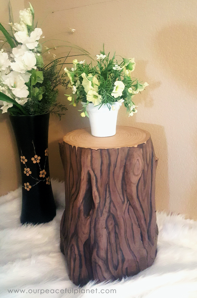 Add some whimsy to your home with this DIY tree stump stool. All you need is a 5 gallon bucket, wood circle, TP tubes, paper mache, foil and paint!