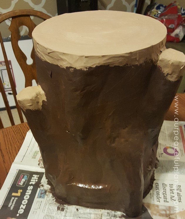 Add some whimsy to your home with this DIY tree stump stool. Remember using paper mache in grammar school? That's what creates the stump effect and it's easier than you think!