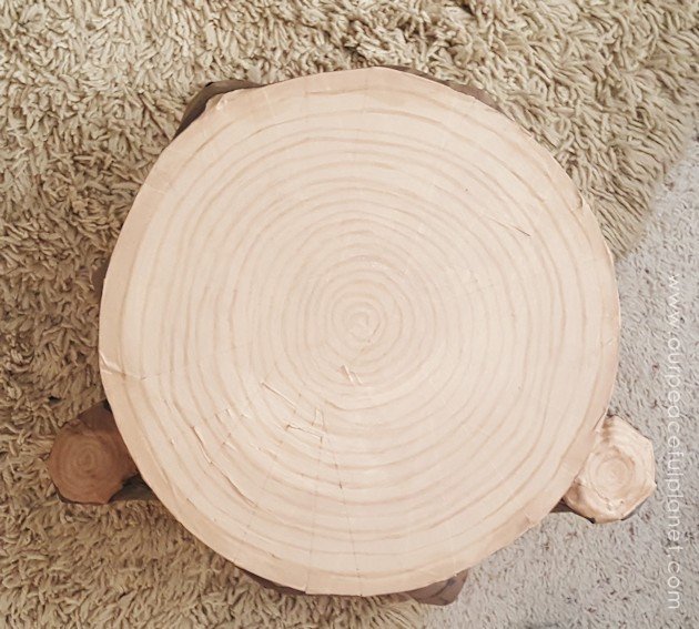 Add some whimsy to your home with this DIY tree stump stool. Remember using paper mache in grammar school? That's what creates the stump effect and it's easier than you think!