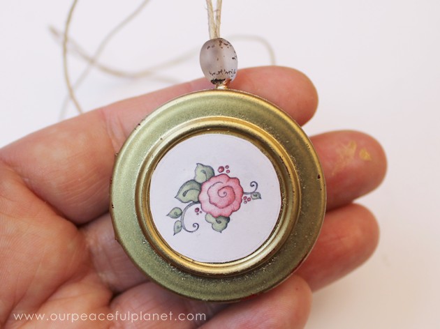 This cute upcycled locket necklace will put a grin on anyone's face and makes a wonderful gift for moms, grandmas or anyone who loves quirky jewelry.
