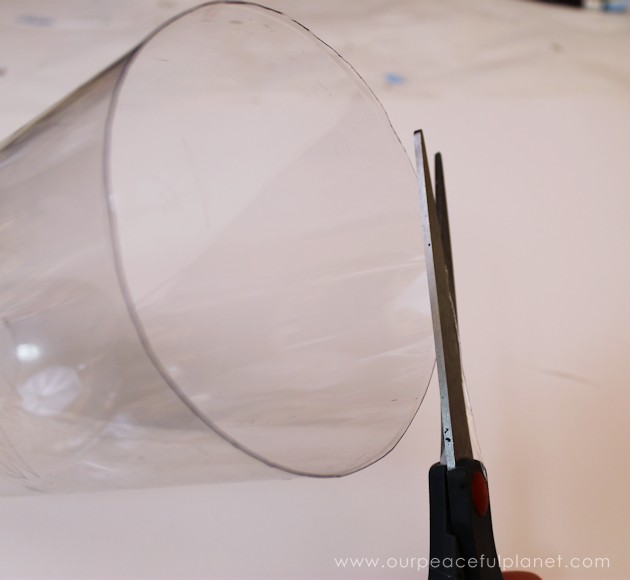 Create this Mid Century Modern Geometric or Confetti plastic bag holder from a 2 liter plastic bottle and DVD. A wonderful upcycle that anyone can do!