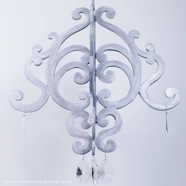 This beautiful diy chandelier is made from $3 foam board. It makes a wonderful accent to any room. Grab our free pattern and add some paint and bling. 