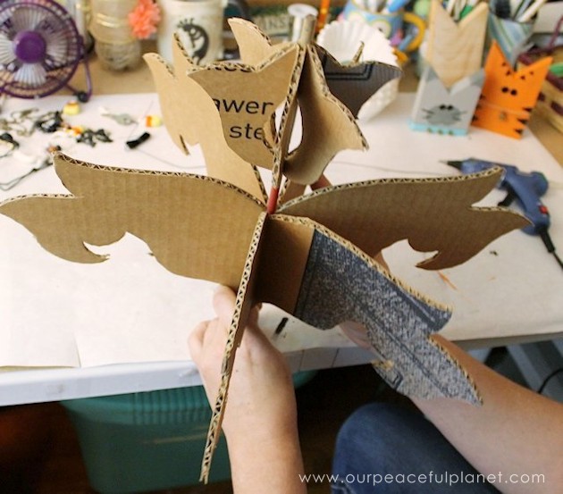 Add a little whimsy to any room with a cardboard chandelier! Grab our free pattern, some cardboard , a hot glue gun and paint. Add any bling you like! 