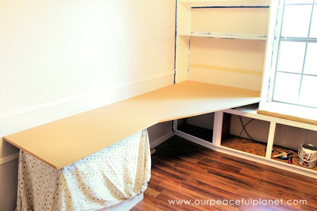 Build a large surface home office desk from inexpensive 3/4" MDF wood. Using items you might already have, no legs are needed. It's easier than you think!