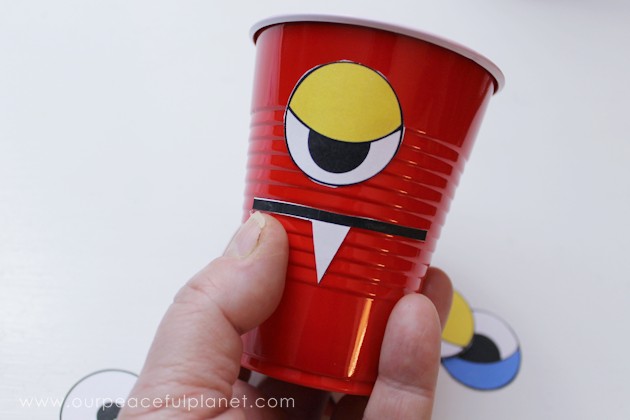 Make a creepy fun monster eye pong party game with plastic cups & ping pong balls. (Beer pong was never this awesome.) Kids & adults alike will love it!