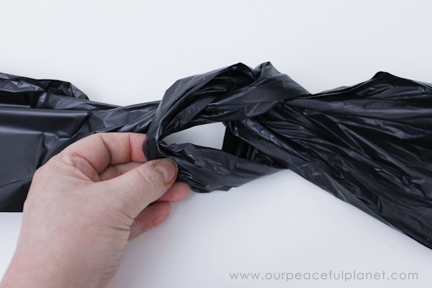 Need quick, low cost awesome looking Halloween decorations? Go to your cupboard, grab some black plastic trash bags & make a large creepy bat in 5 minutes!