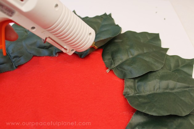 Make these elegant poinsettia Christmas placemats using a large piece of felt, some artifical poinsettias and hot glue. They also make a great centerpiece!