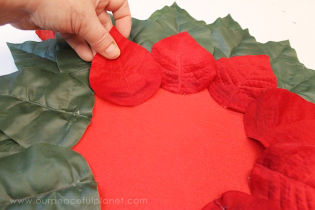 Make these elegant poinsettia Christmas placemats using a large piece of felt, some artificial poinsettias and hot glue. They also make a great centerpiece!