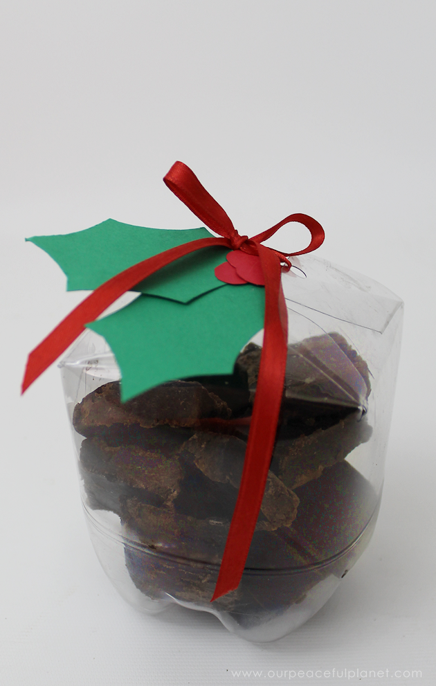 These upcycled plastic soda bottles make unique Christmas gift wrapping ideas and are perfect for our healthy chocolate fudge recipe as a neighbor gift!