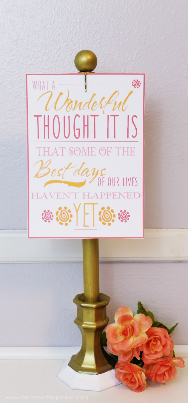 This classy display clip stand is made from a candle holder, dowel and bobby pin and it can not only display he free printable motivational quotes below but photos and more!