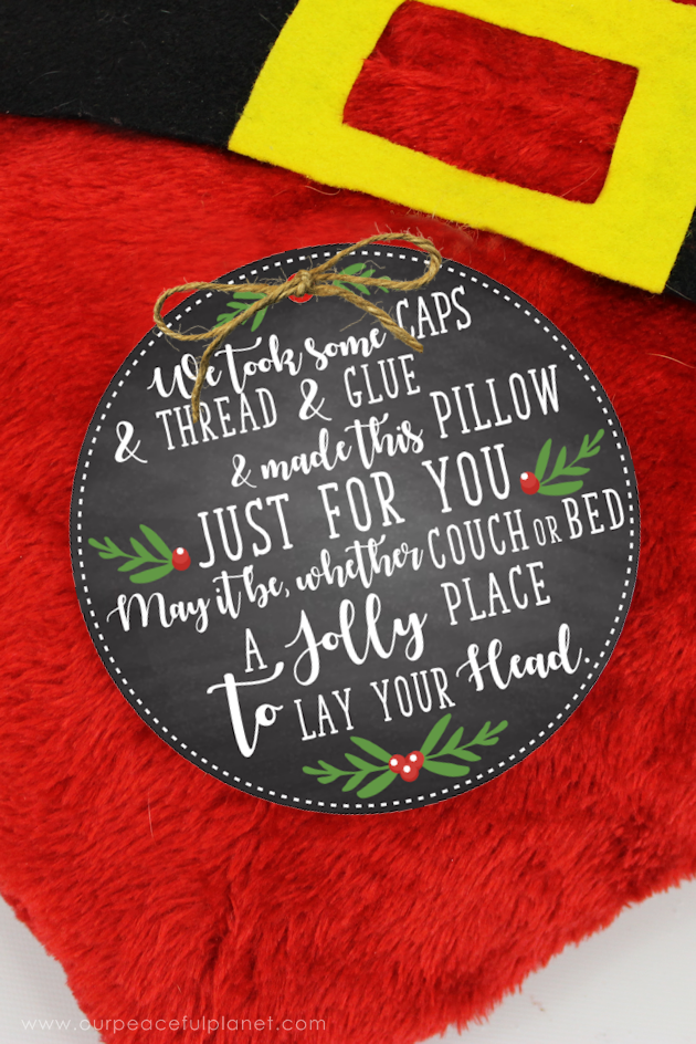 With four Dollar store Santa hats, you can make the cutest two-sided Santa pillow ever! Keep it or give them away as neighbor gifts! Free fun printable tags.