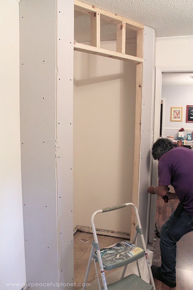 Add space and convenience to your small kitchen with this simple DIY pantry! It has floor to ceiling shelves, a door and it fits perfectly into a corner.
