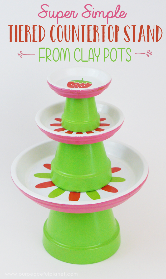 This small DIY cake stand can hold so much more! Fruit, cookies, nuts, candy, tea bags etc. Made from clay pots it’s simple and inexpensive to make.