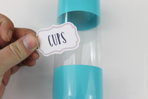 This cup dispenser is part of our matching Contemporary Kitchen Craft series. Hang it anywhere. It works and looks great! Best soda bottle upcycle ever!