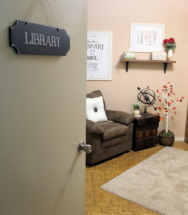 We made a simple room divider and turned a laundry room into a laundry slash home library that has a global feel and you won't believe how easy it was!