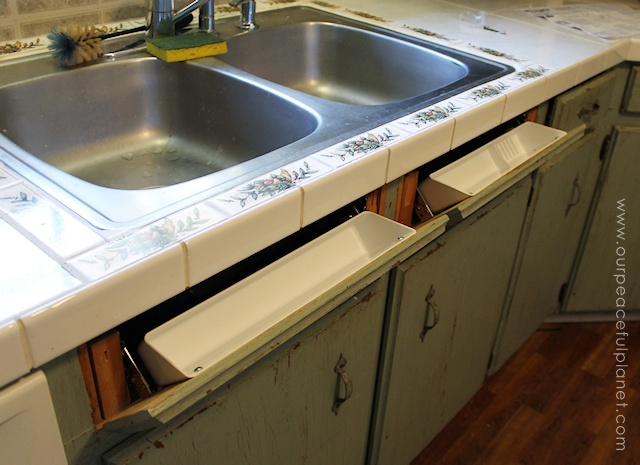 Get rid of sink clutter and utilize wasted space by instlaling tip out hidden trays in your kitchen!